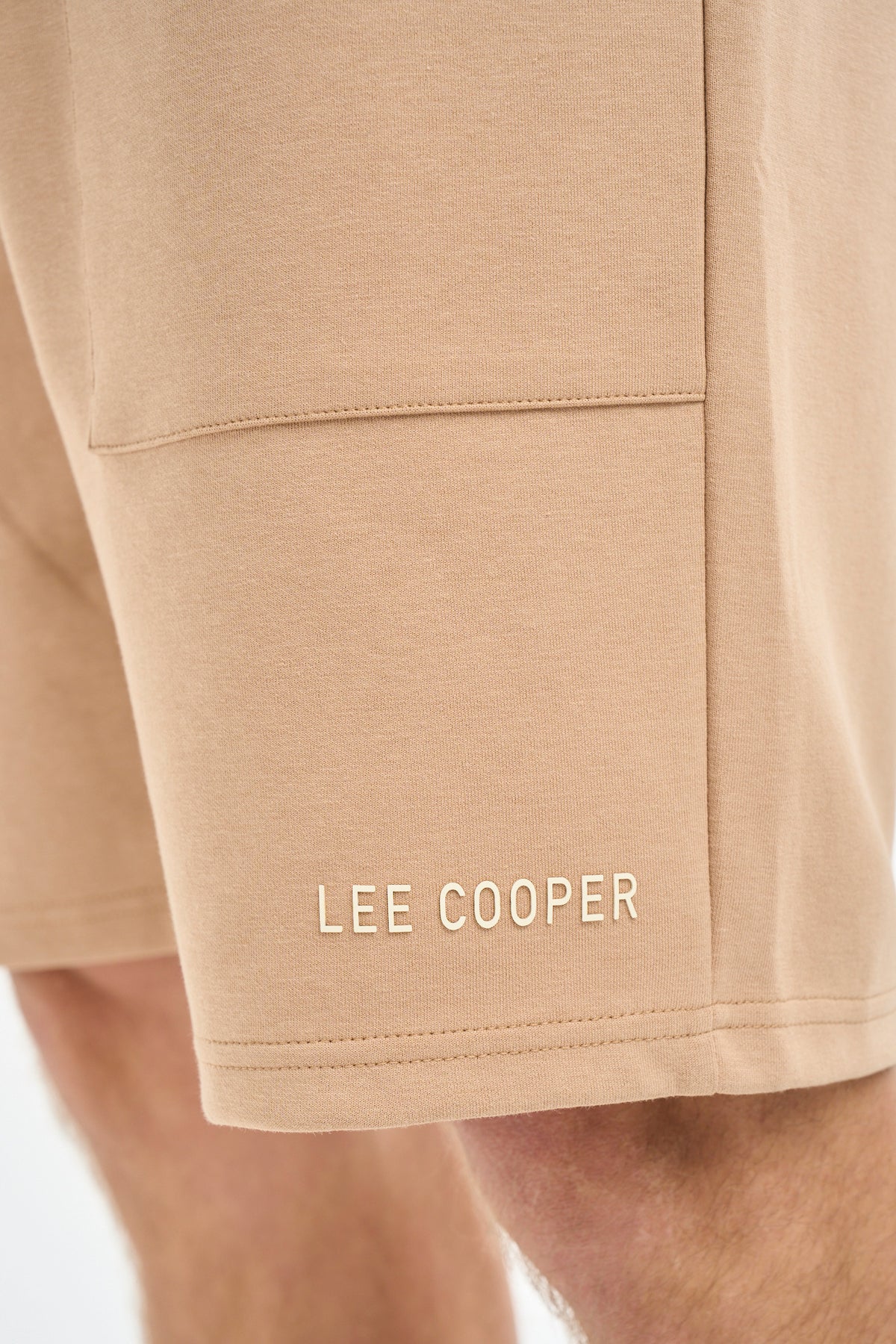 Brown Lee Cooper Max men's shorts, casual Bermuda style with a relaxed fit, displayed on a hanger against a neutral background.
