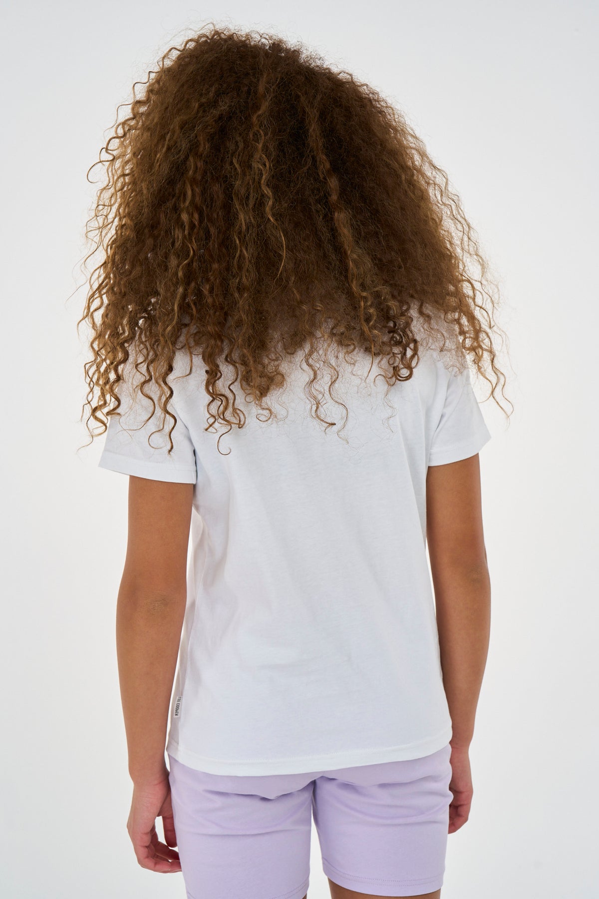 White Lee Cooper Atieno Kids T-Shirt with short sleeves and round neckline, casual and comfortable for children.