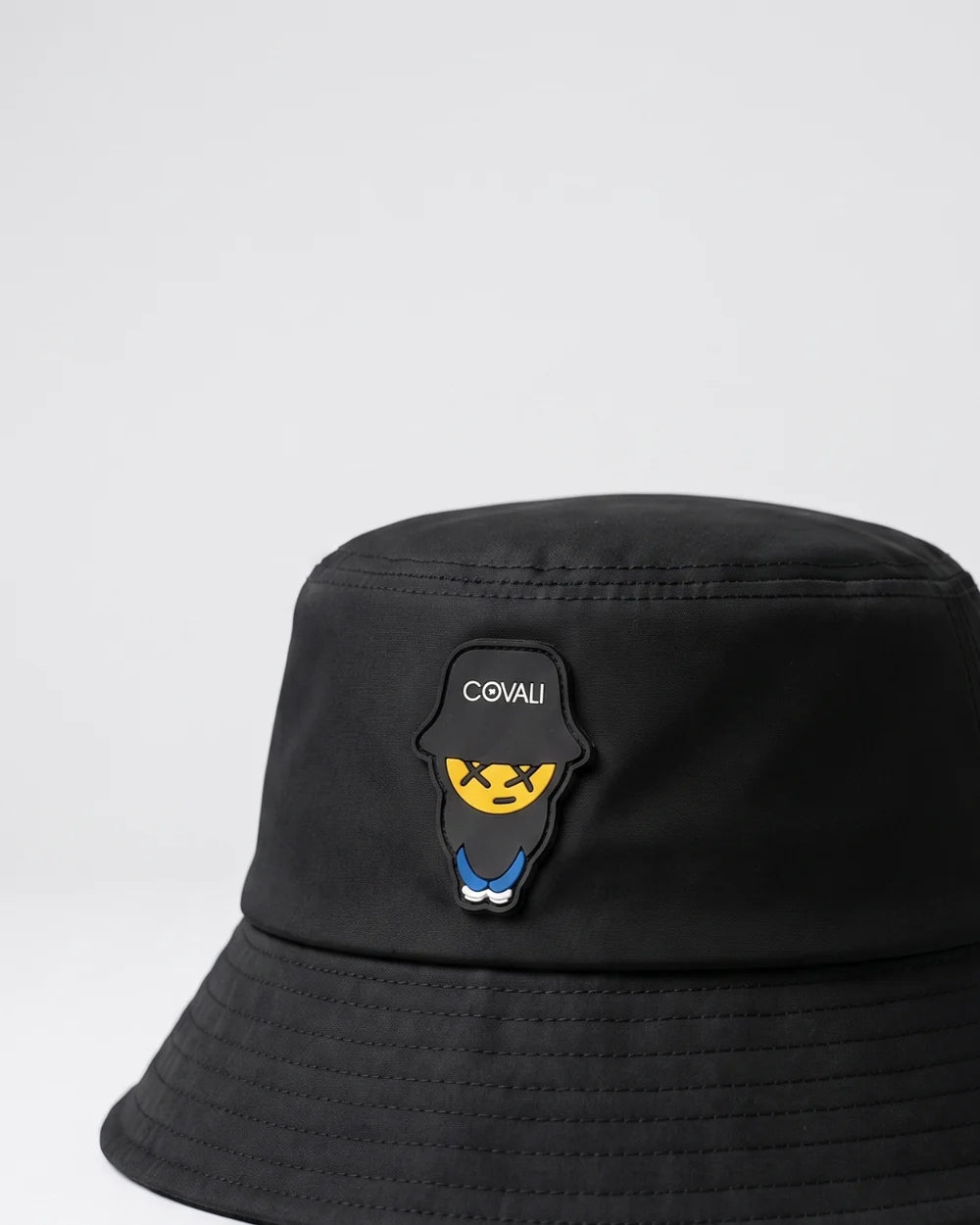 Black Covali Tipo Bucket Hat by Shazem, men's headwear with a wide brim and casual style, shown from a front angle.