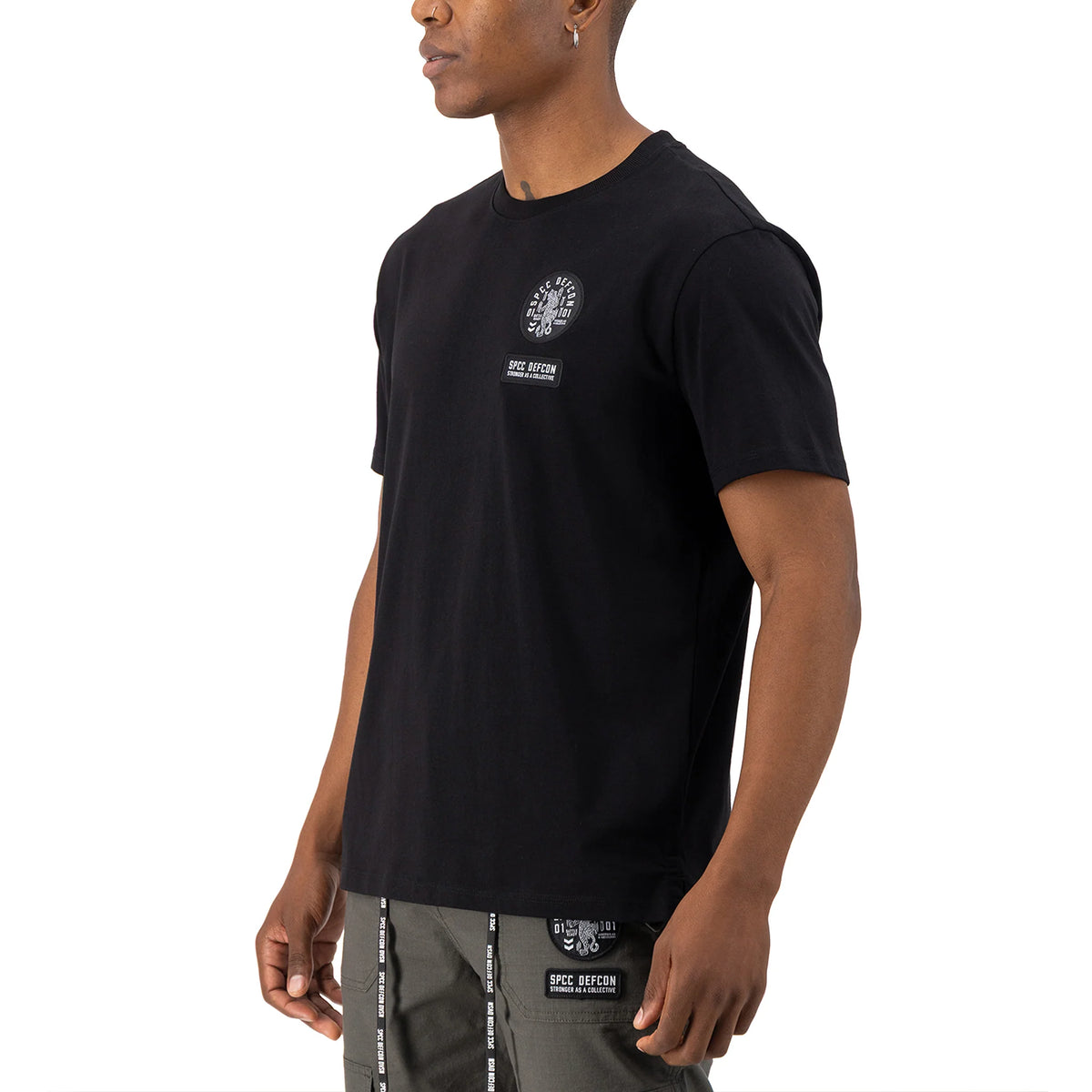 Black SPCC DEFCON Madra T-shirt for men featuring a bold graphic design on the front.