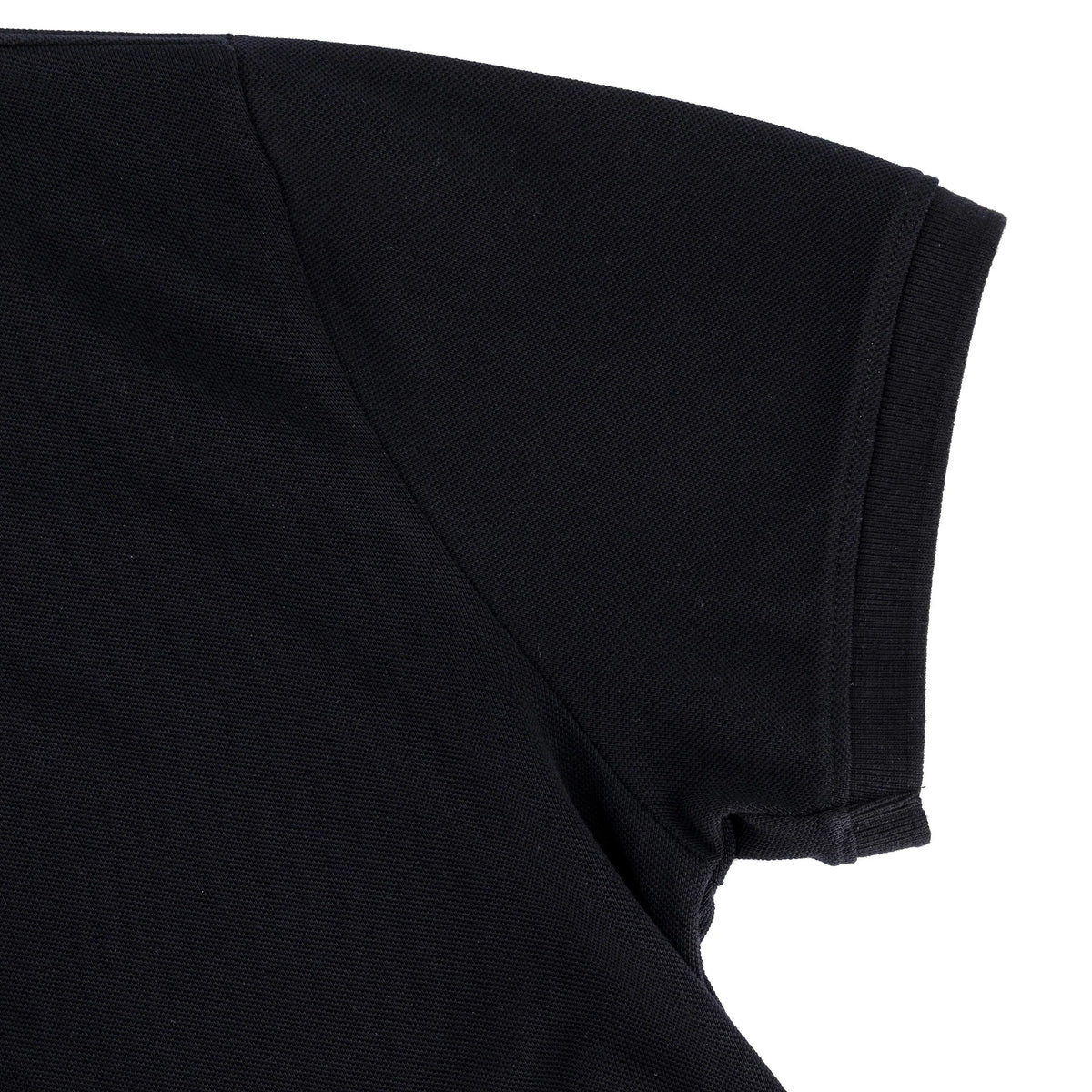 Men's black golfer shirt by SPCC, the Spcc Nohr Golfer, shown in a close-up image highlighting the fabric and fit.