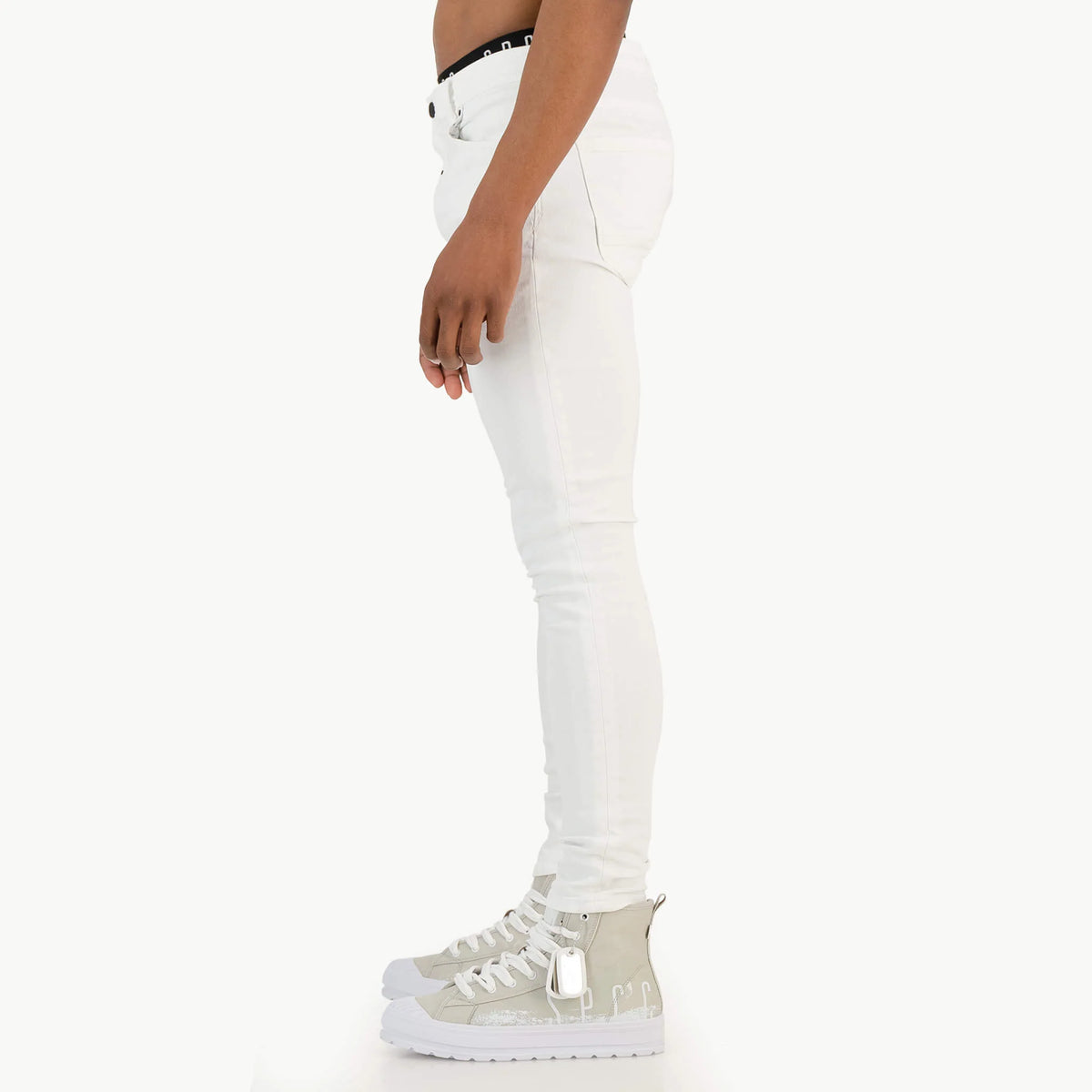 White SPCC Shadowfax men's jeans with classic fit and denim texture, shown hanging on a wooden background.