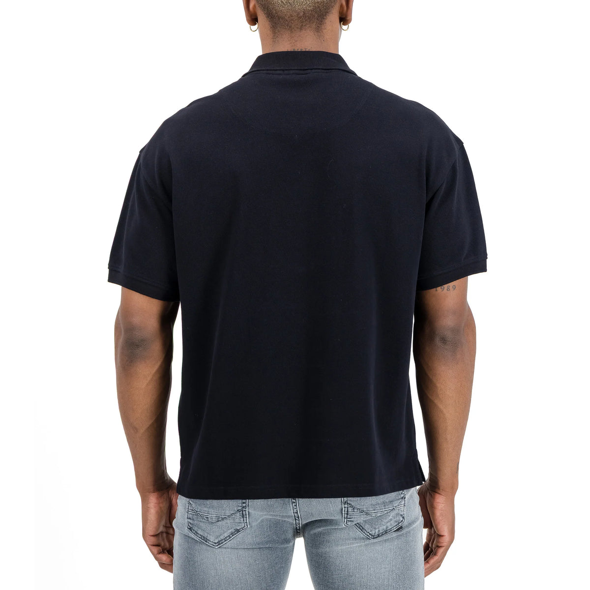 Men's SPCC Nohr Golfer in black, showcasing the classic design and smooth fabric of the black men's golf shirt.