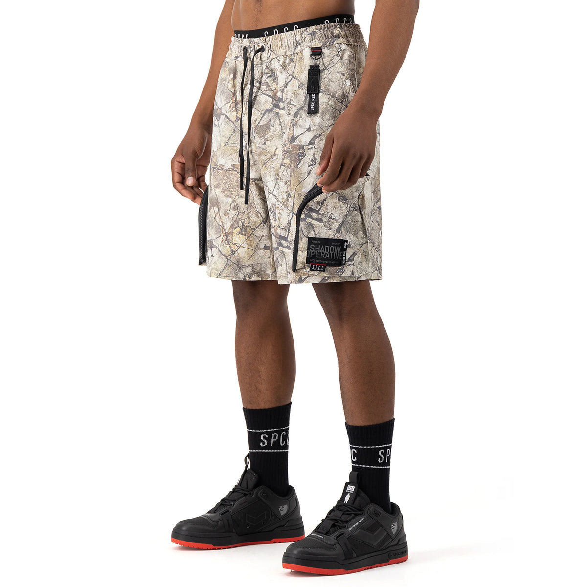 Men's SPCC Incognito Woven Short in stone color, casual Bermuda style with a relaxed fit and woven fabric.