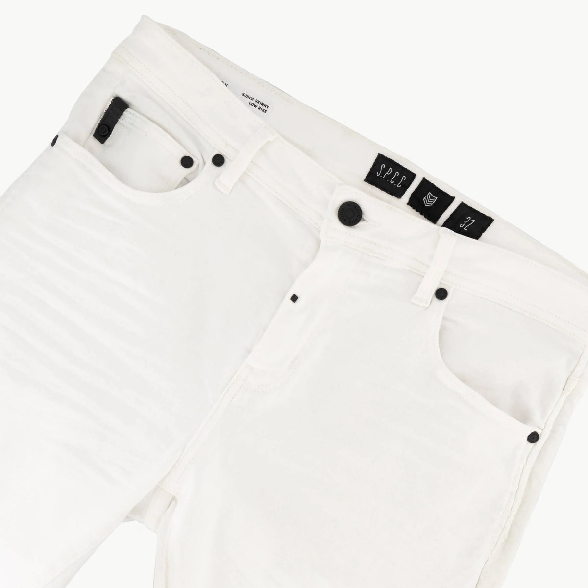 Men's white SPCC Shadowfax jeans with classic denim texture and five-pocket design, shown on a model.