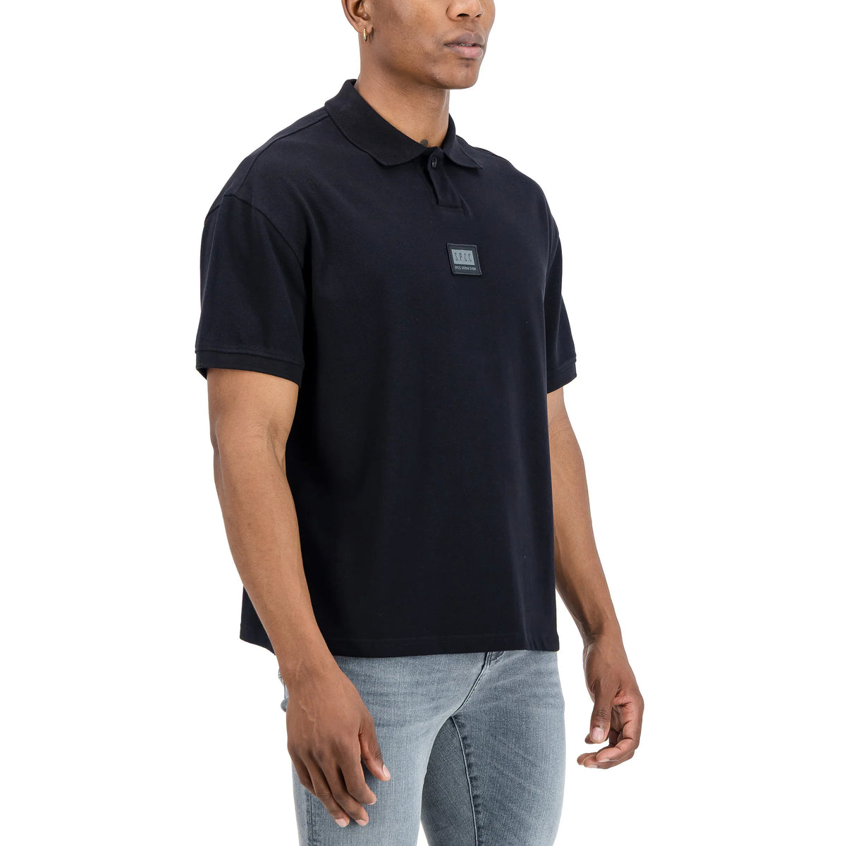 Men's SPCC Nohr Golfer in black, showcasing the classic collar and short sleeves, ideal for casual or golf wear.
