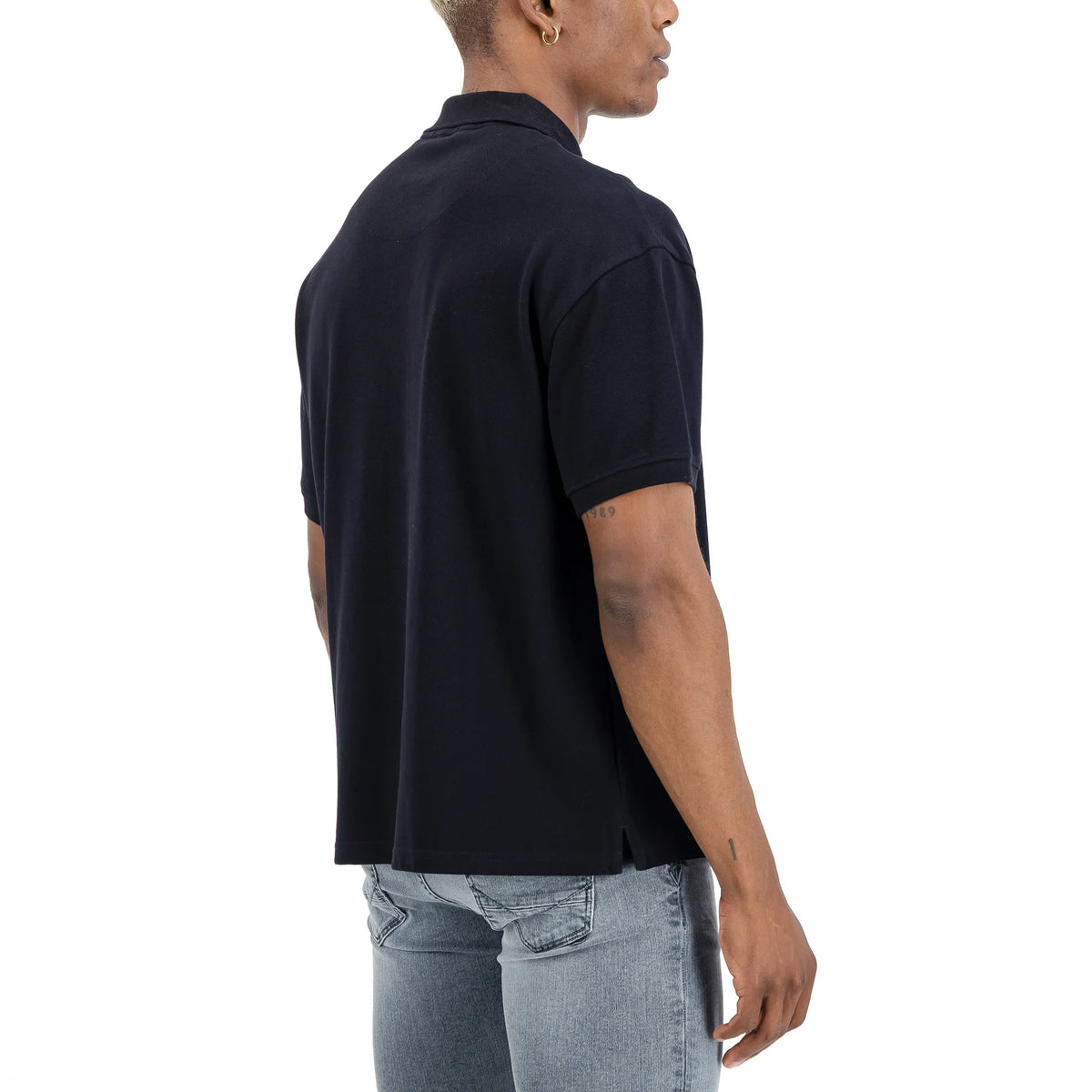 Men's SPCC Nohr Golfer in black, stylish golf shirt with a classic fit and subtle branding, suitable for casual or sport golf activity.