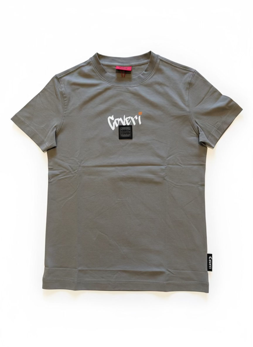 Gray t-shirt with brand logo on a beige surface