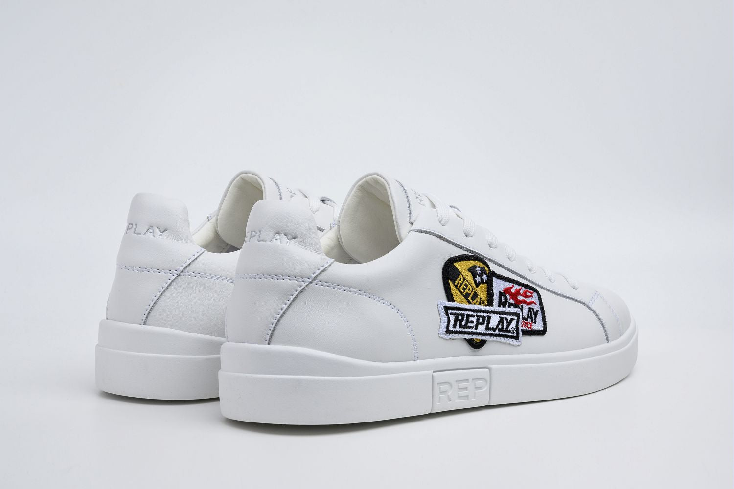 Replay Polys M Combo White men's sneakers with white and black design, featuring laces and sporty silhouette.