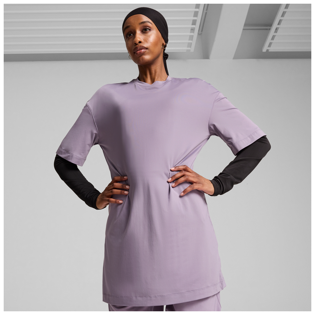 Puma Modest Oversized Pale Plum T-shirt for women, featuring a relaxed fit and soft fabric, displayed on a model.