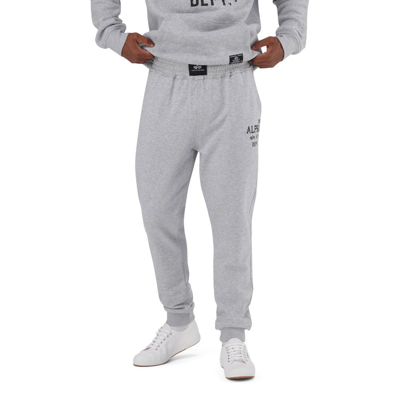 Men's Alpha ATH Dept Melange Trackpant with comfortable fit and stylish design, shown in a relaxed pose.