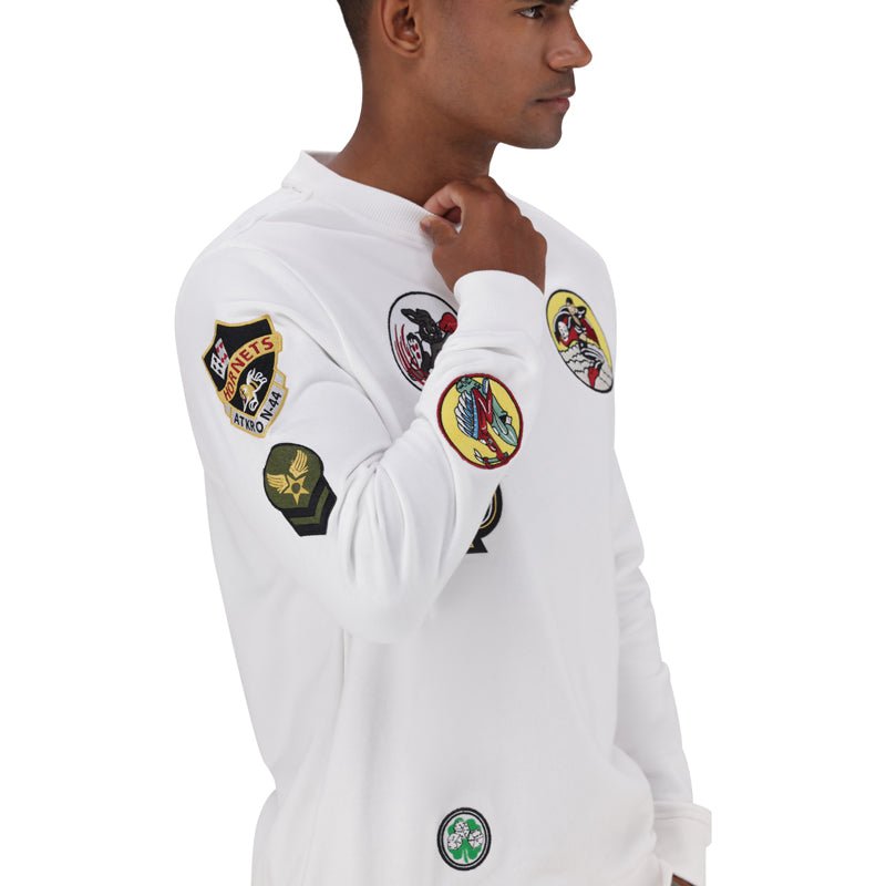 White men's crew neck sweatshirt by ALPHA with multiple badge details on the chest and sleeves.