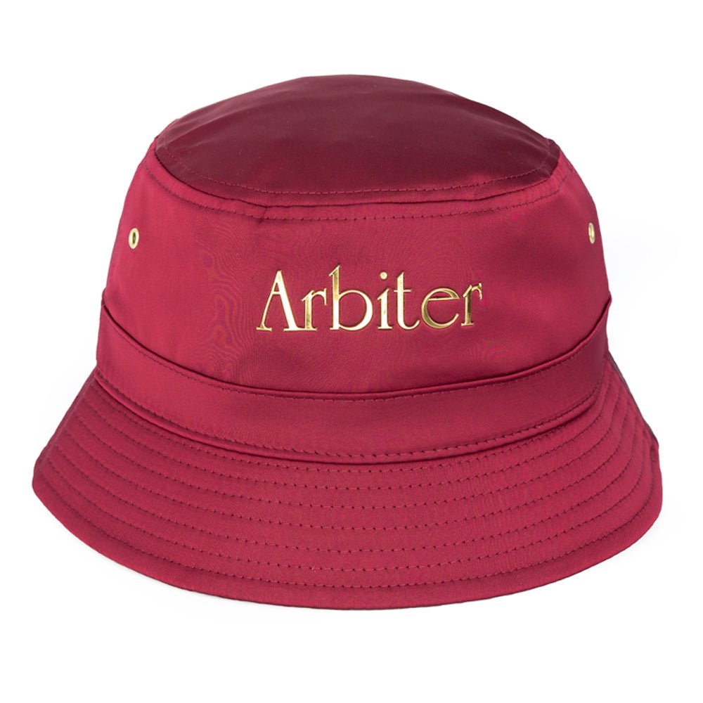 Unisex burgundy satin bucket hat by Arbiter, featuring a smooth, shiny fabric and a classic wide-brim style.