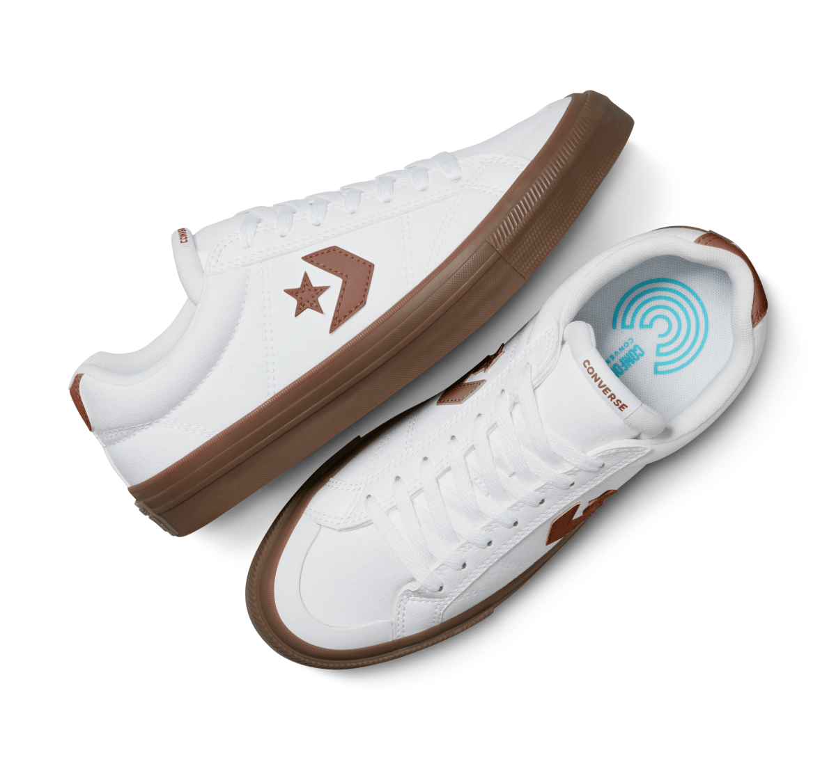 White and red Converse unisex sneakers with casual design, featuring classic canvas material and white rubber soles.