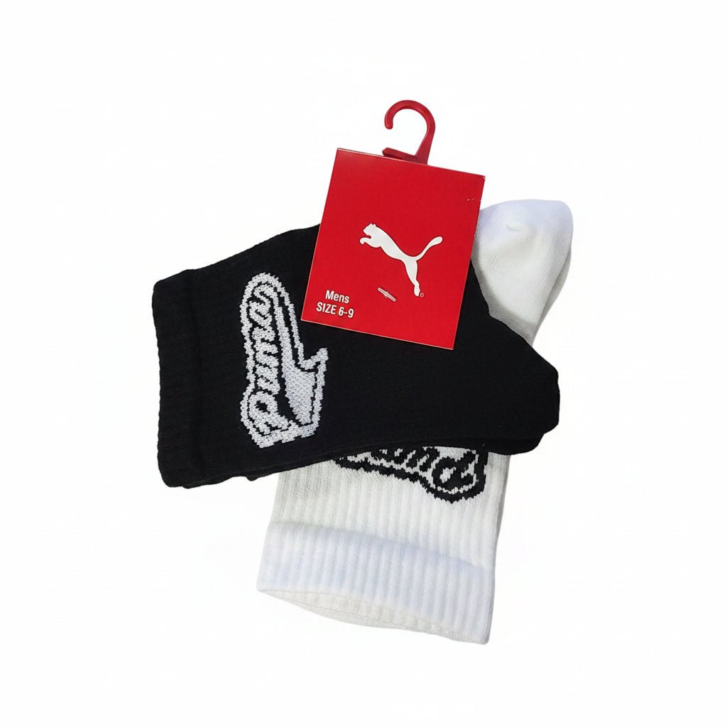 Two pairs of Puma men's crew socks with small logo design, made of comfortable fabric for everyday wear.