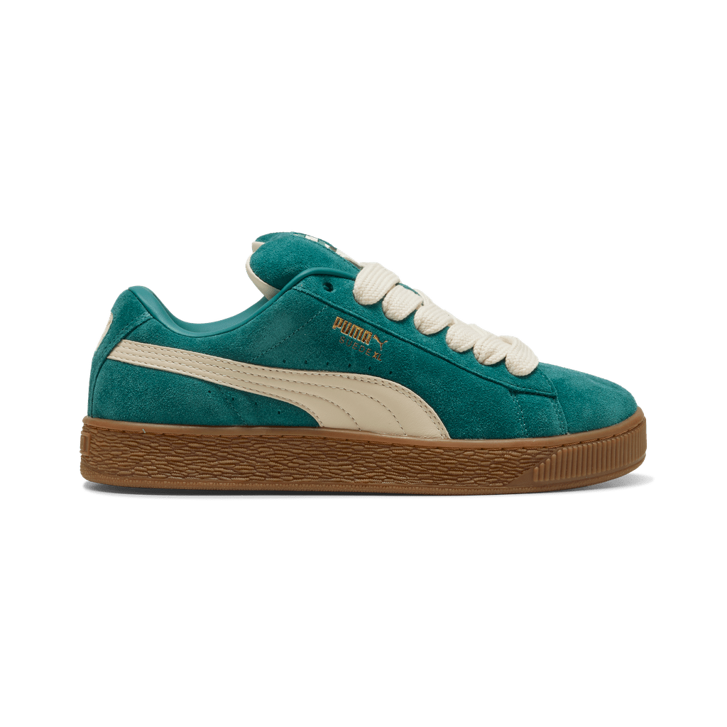Puma men's Suede XL sneakers in navy blue with white accents, showcasing the classic low-top design and suede material.
