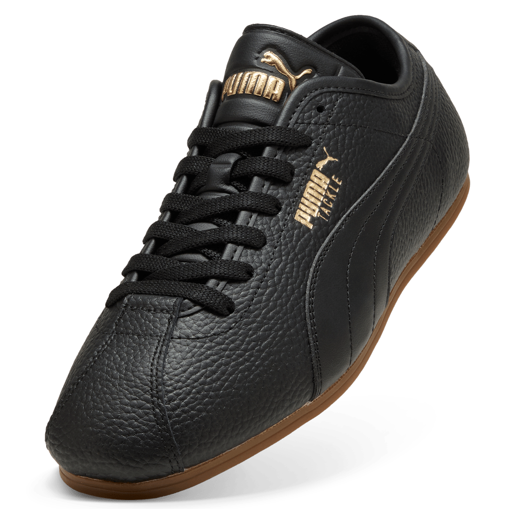 Puma men's Tackle L sneakers in black with gold and gum accents, featuring sporty design and cushioned sole.