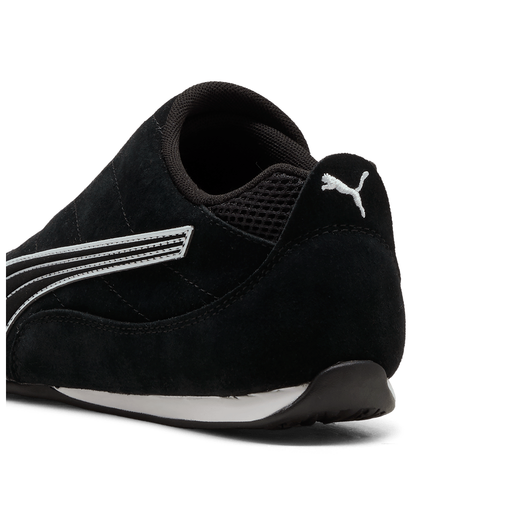 Puma women's Catch Soleil slip-on sneakers in black and white with sleek design and comfortable fit.