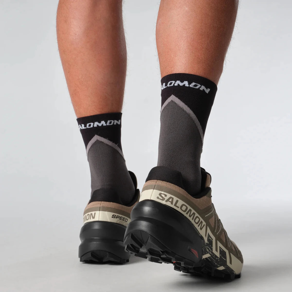 Men's Salomon Speedcross 6 sneakers in natural, black, and almond milk color with rugged trail running design.
