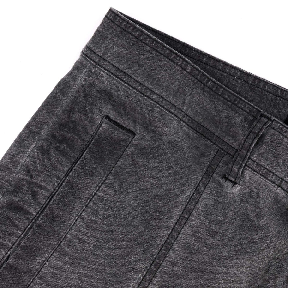 Black SPCC Alden Cargo men's jeans with multiple pockets, made from durable denim fabric, shown on a plain background.