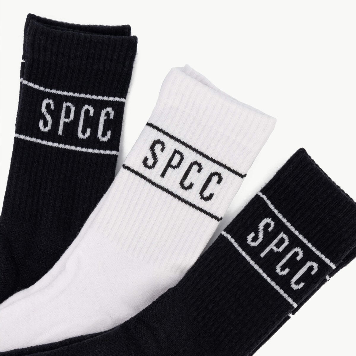 Set of three SPCC Declen men's socks in black and white, featuring comfortable knit fabric and casual style.