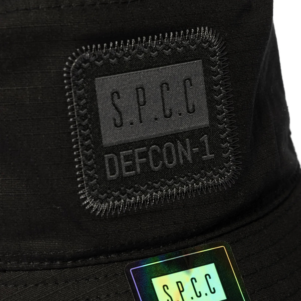 Black SPCC Defcon-1 bucket hat for men, stylish headwear with a wide brim and casual design, perfect for everyday wear.