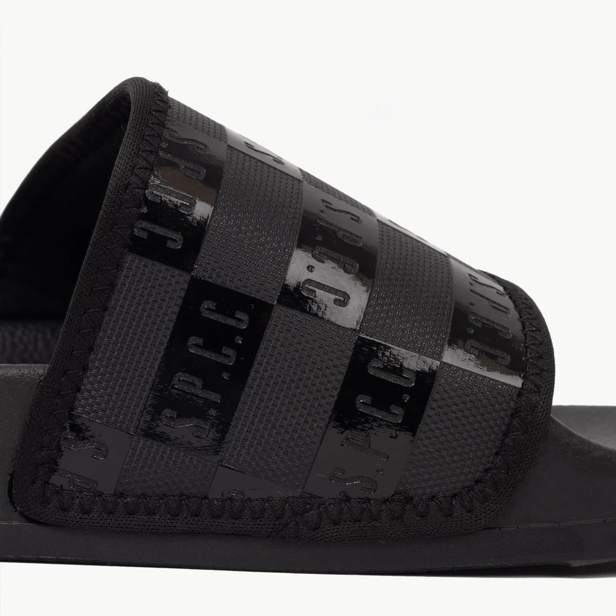 Black SPCC Dermott Slider men's sandals with wide straps and cushioned footbed, designed for comfort and casual wear.
