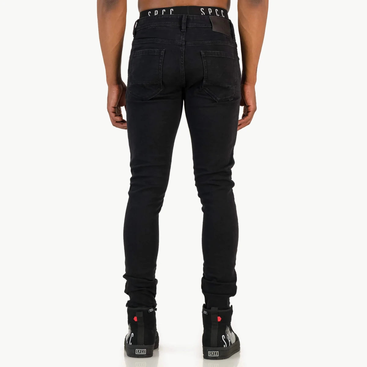 Black SPCC Onyx men's jeans with a slim fit, showcasing classic denim texture and detailed stitching.