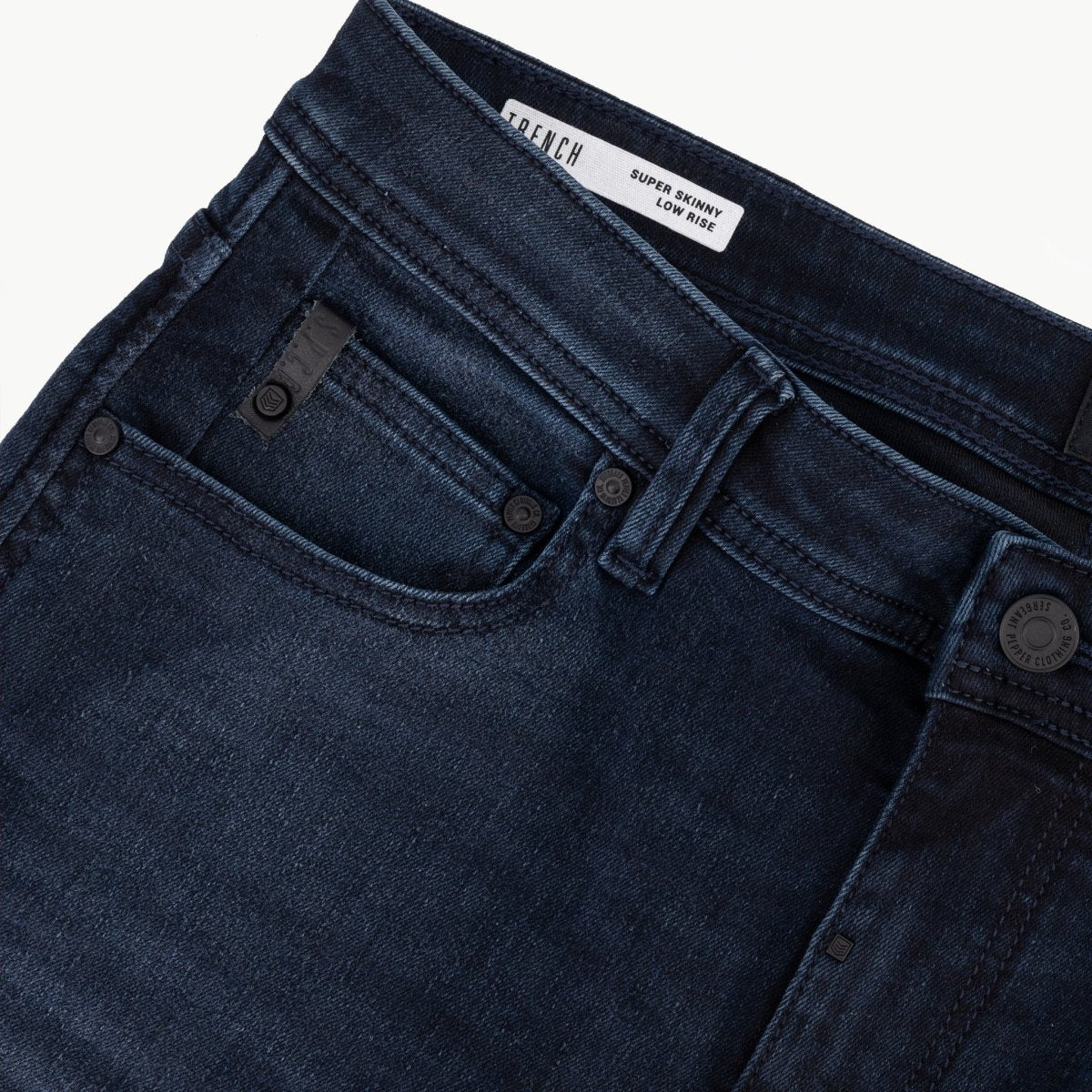Men's SPCC Royale Indigo Jeans showing classic fit, denim fabric, and detailed stitching in a natural pose.