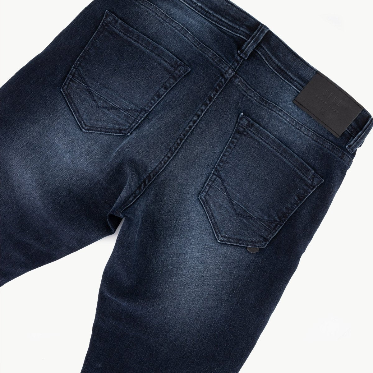 Men's SPCC Royale Jean in indigo denim, featuring a classic fit and detailed stitching, shown on a plain background.