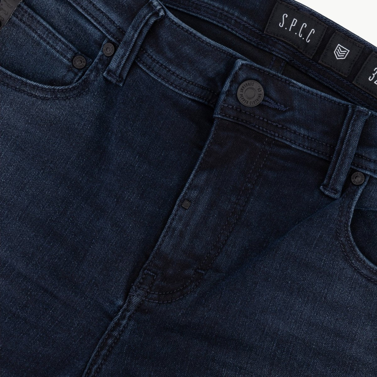Men's SPCC Royale Indigo Jean with classic fit, visible stitching, and five-pocket design in durable denim fabric.