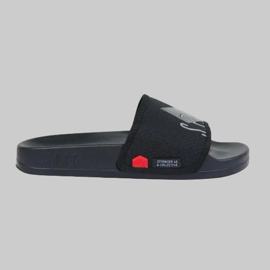 Black SPCC Surge Dusk men's slide sandals with wide straps and cushioned footbed, perfect for casual summer wear.