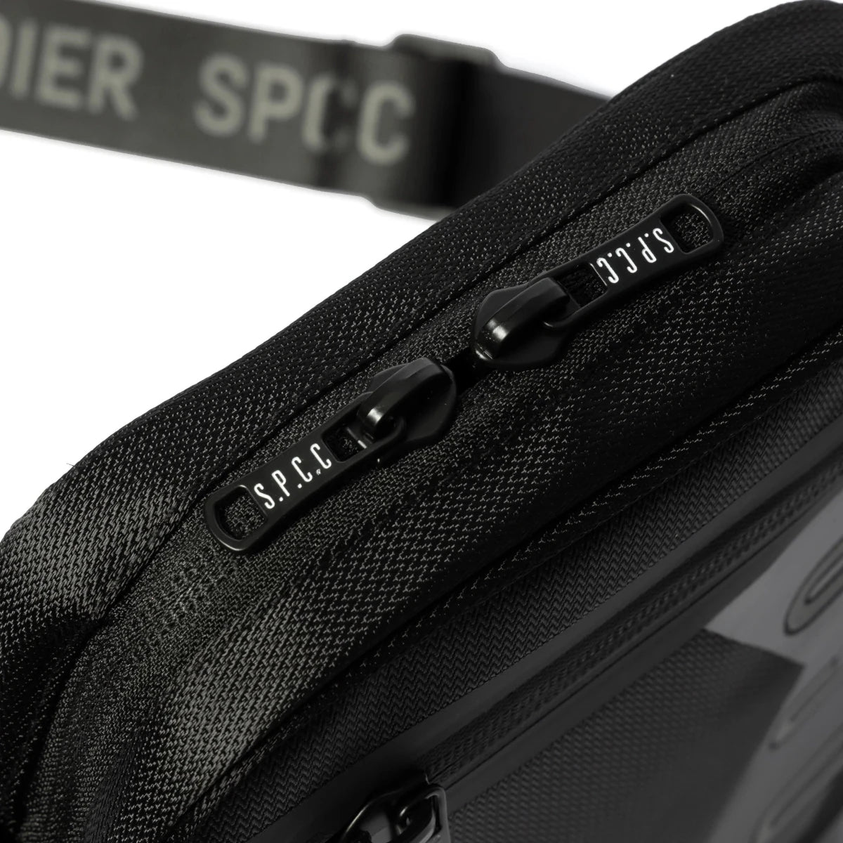 Black SPCC Surge Dust hip bag for men, compact luggage with adjustable strap and multiple storage compartments.
