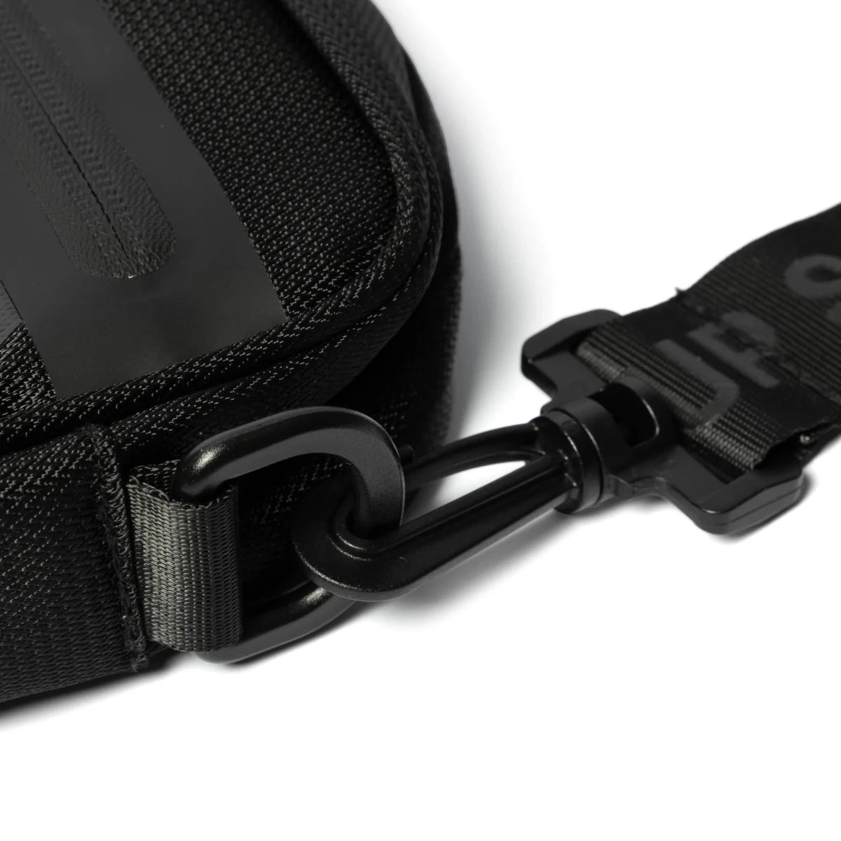 Black SPCC Surge Dust hip bag for men, a compact luggage accessory with multiple compartments and adjustable strap.