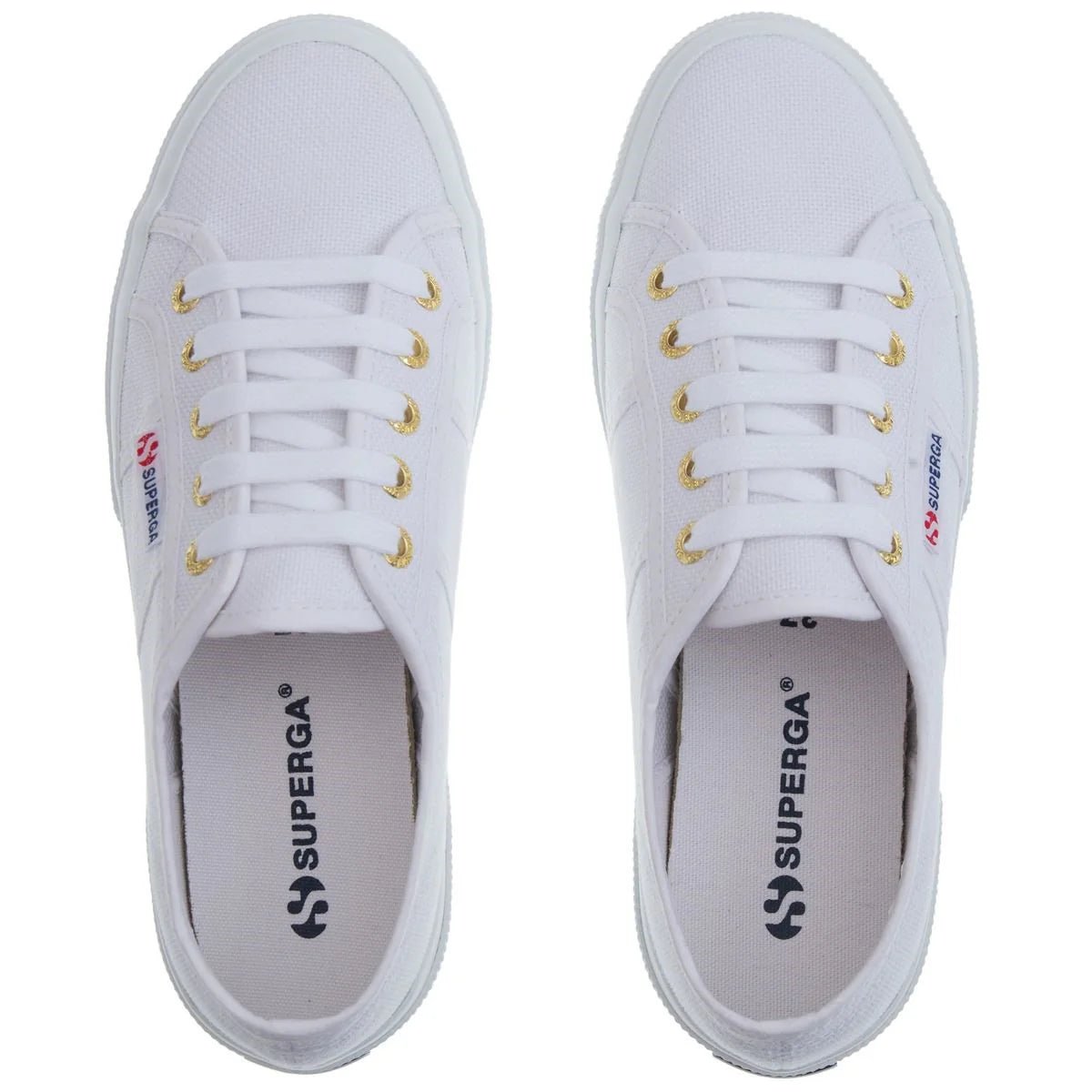 White Superga 2750 women's sneakers with pale gold accents, casual canvas shoes, side view showing classic design.