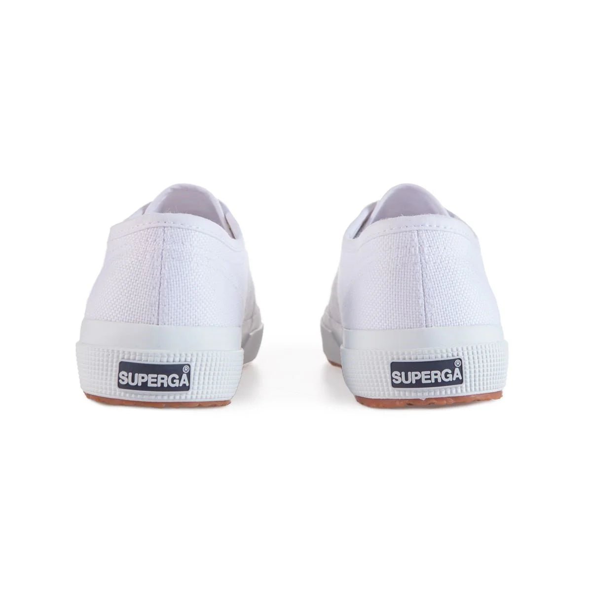 White Superga 2750 women's sneakers with pale gold accents, classic canvas design, and rubber sole.