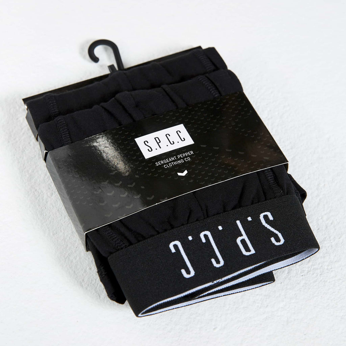 Two black SPCC Emperador boxer briefs for men, showing the snug fit and soft waistband in a close-up image.