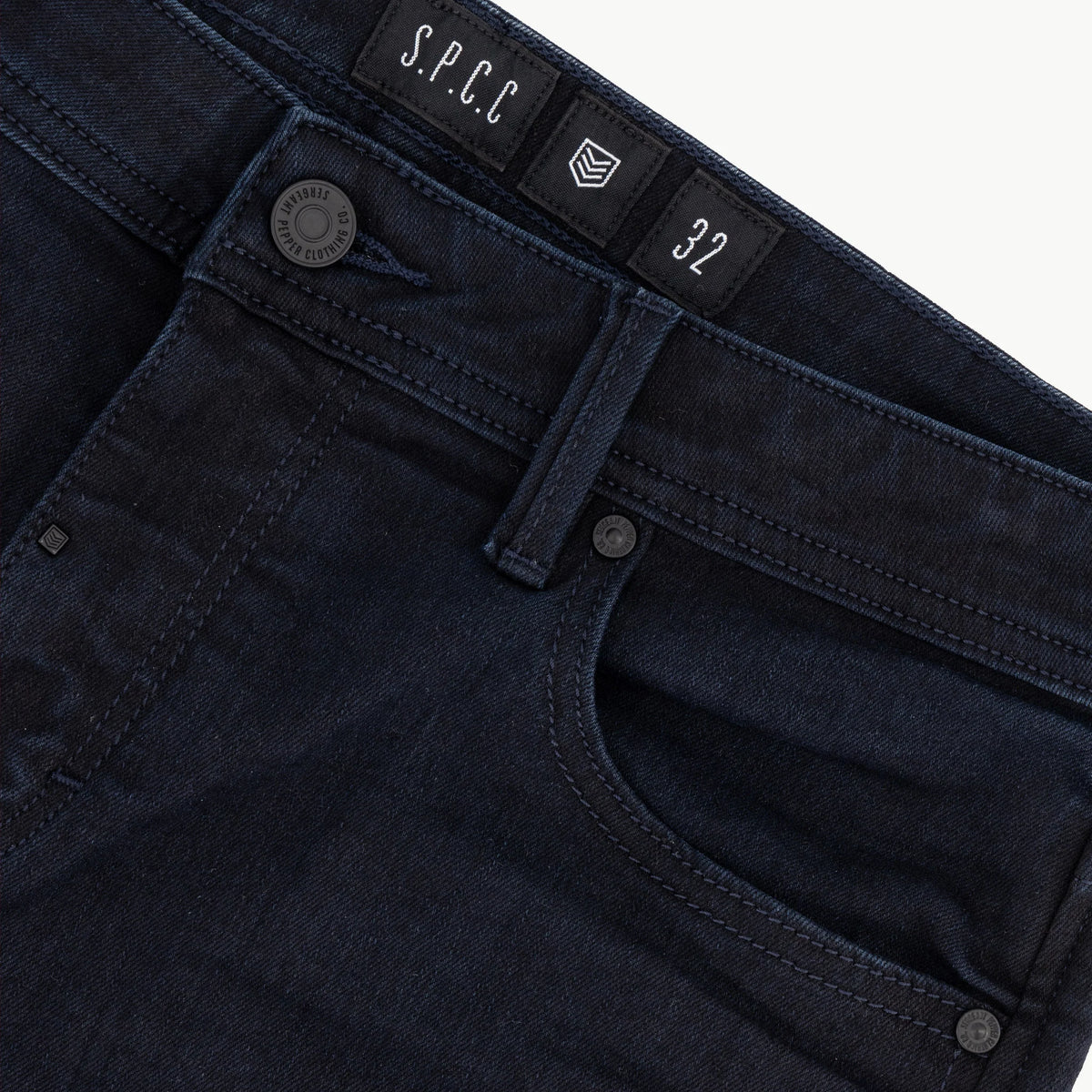 Men's black Spcc Eclipse jeans, slim fit denim pants with classic five-pocket design, shown on a model.