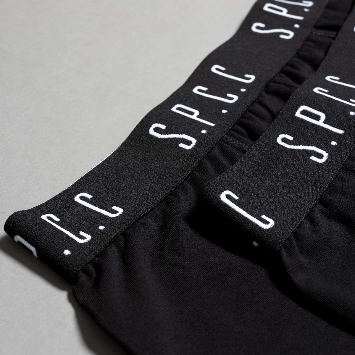 SPCC Emperador Boxer underwear for men in black, two-pack, comfortable cotton fabric, close-up view of waistband and fabric details.