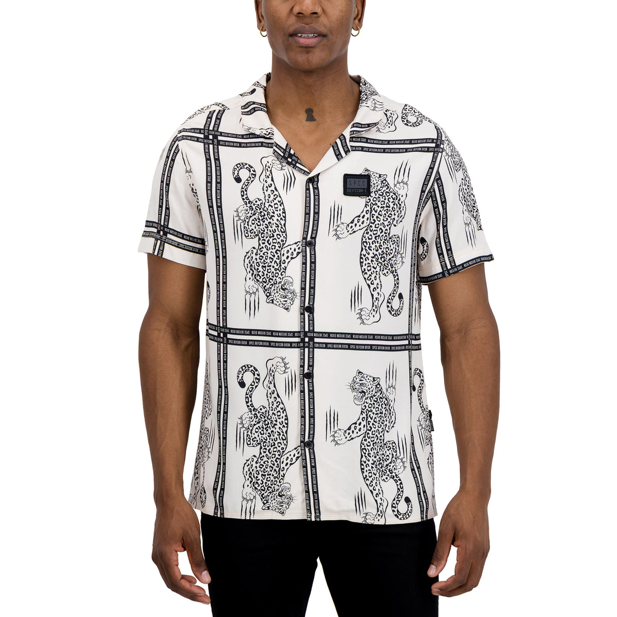 Off-white SPCC Defcon Raxen men's shirt with a relaxed fit and classic collar, displayed on a hanger.