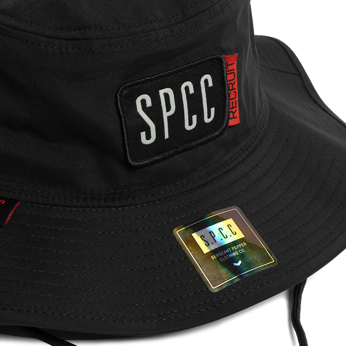 Black SPCC Recuit II bucket hat for men, shown from the front with brim and fabric texture visible, part of men's headwear collection.