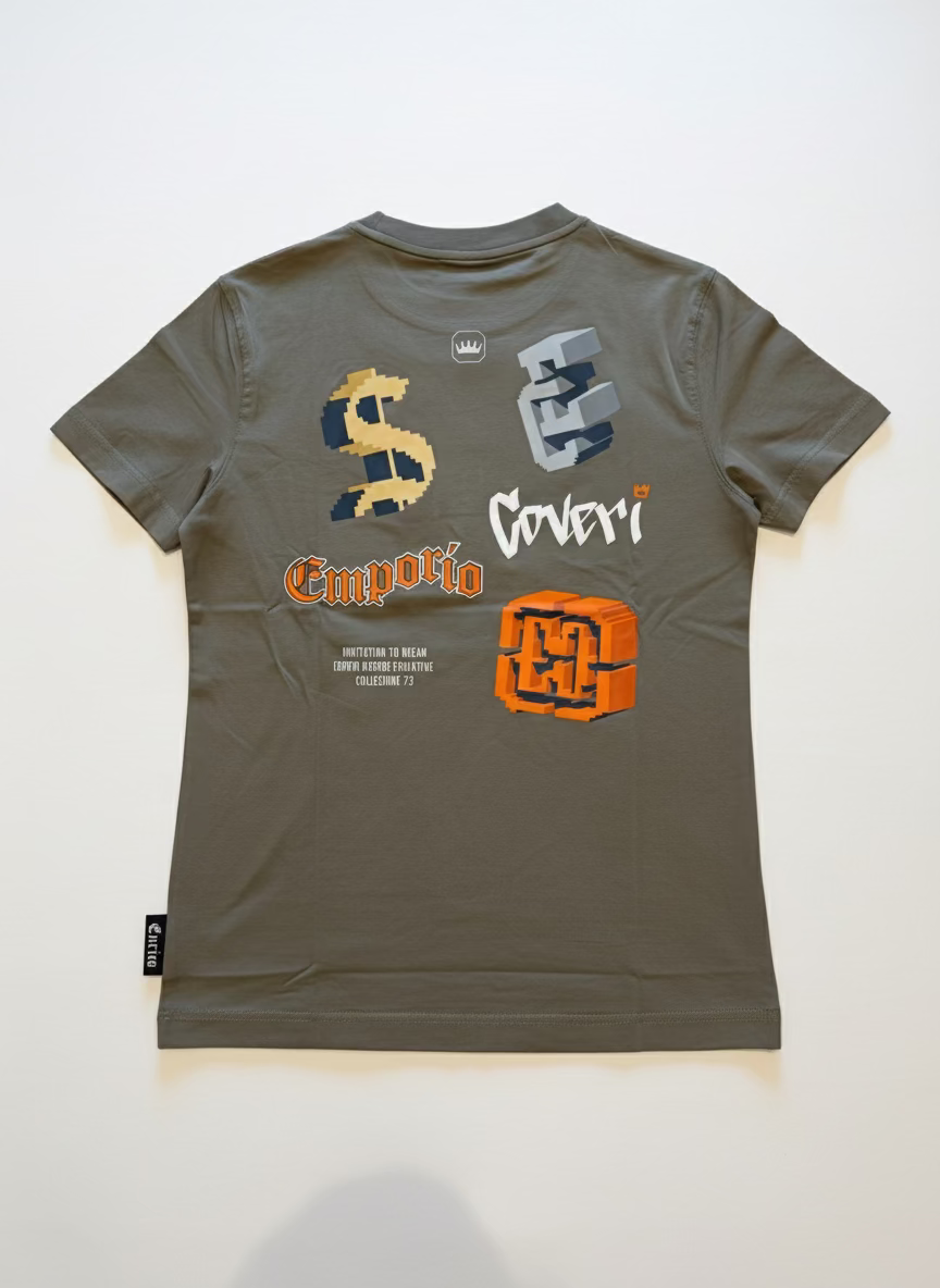 Gray t-shirt with various logos on a textured surface