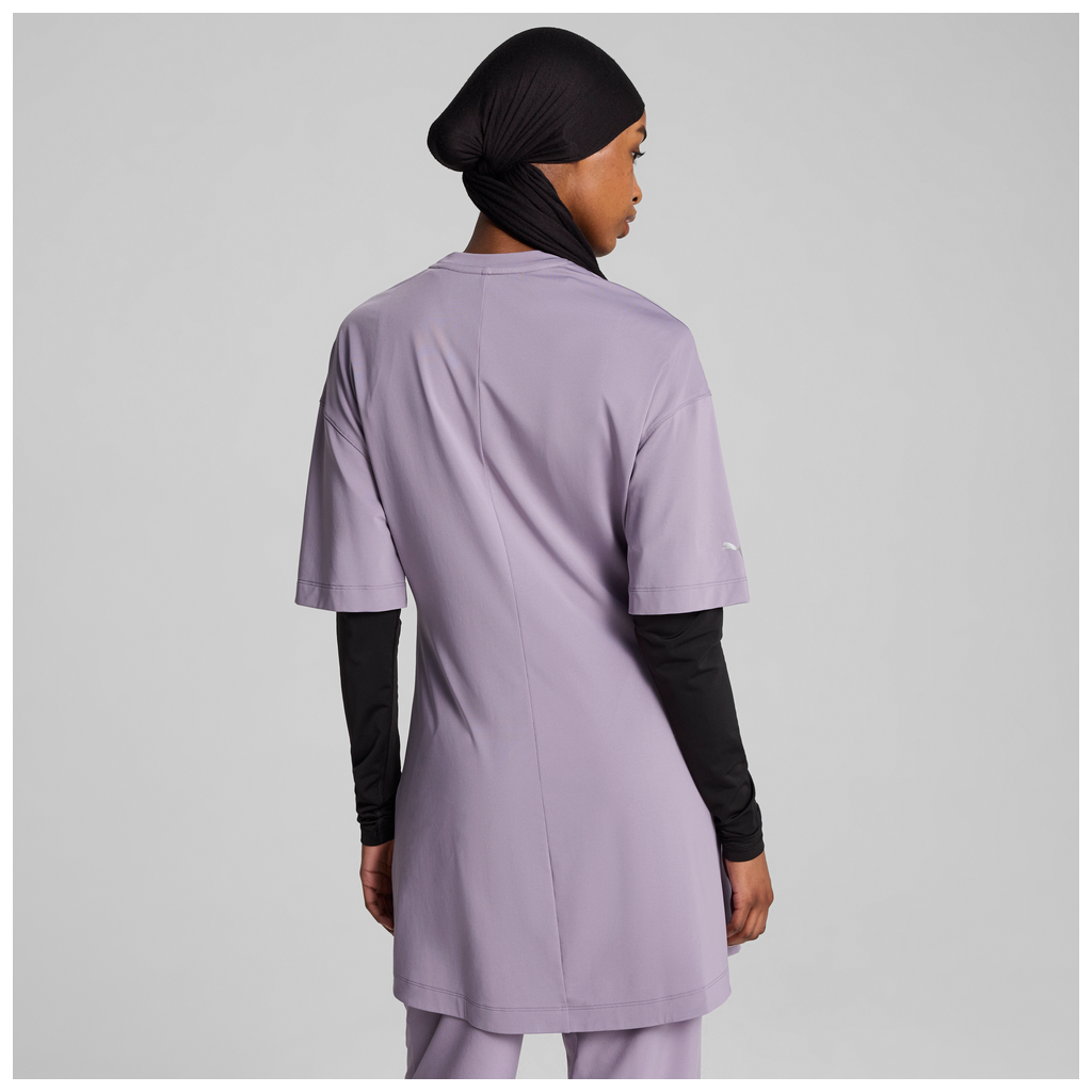 Puma women's oversized modest tee in pale plum with a relaxed fit and short sleeves, displayed on a model.