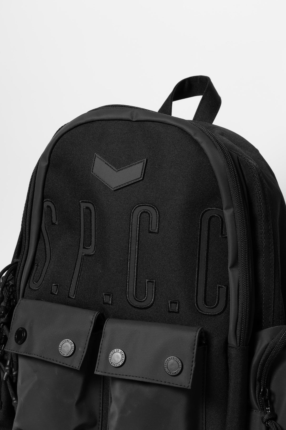 Black SPCC Cyrus backpack for men, stylish luggage with multiple compartments, shown from the side view.