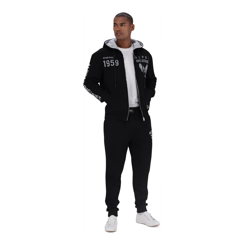 Black men's Alpha ATH Dept trackpants with a relaxed fit, featuring elastic waistband and side pockets for comfortable athletic wear.