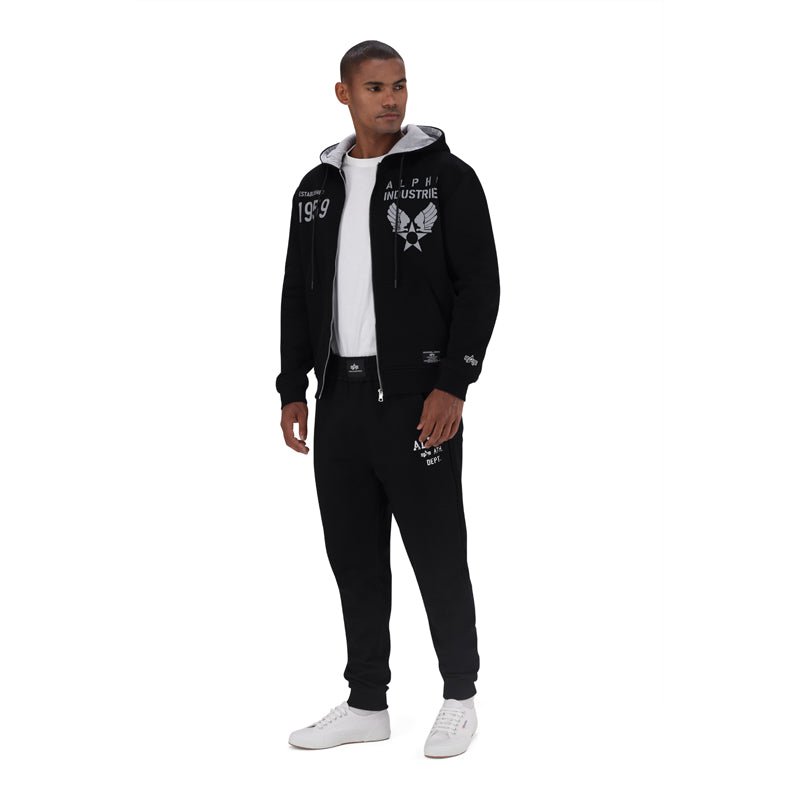 Black Alpha ATH Dept men's track pants with a relaxed fit and elastic waistband, designed for athletic and casual wear.