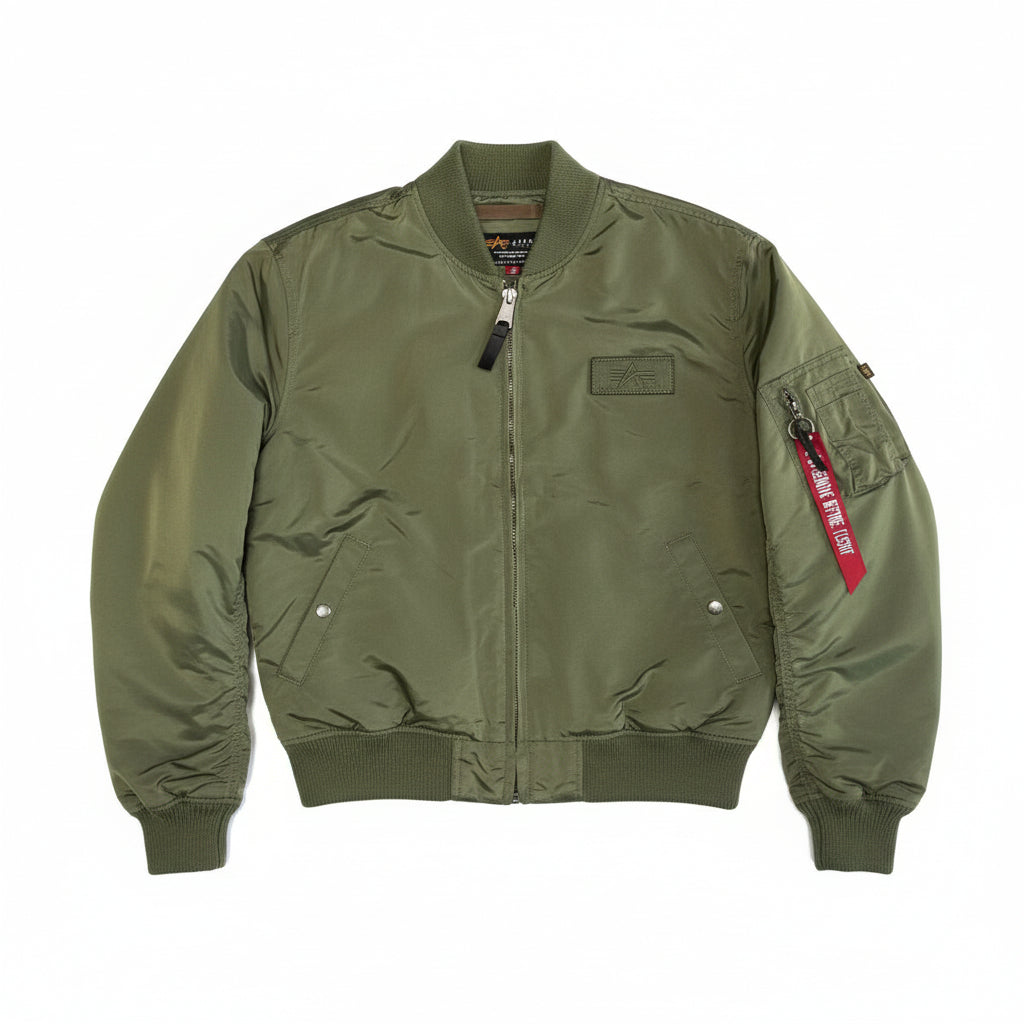 Unisex Alpha MA-1 TT Jacket in sage green with ribbed cuffs and collar, featuring front pockets and a zip closure.