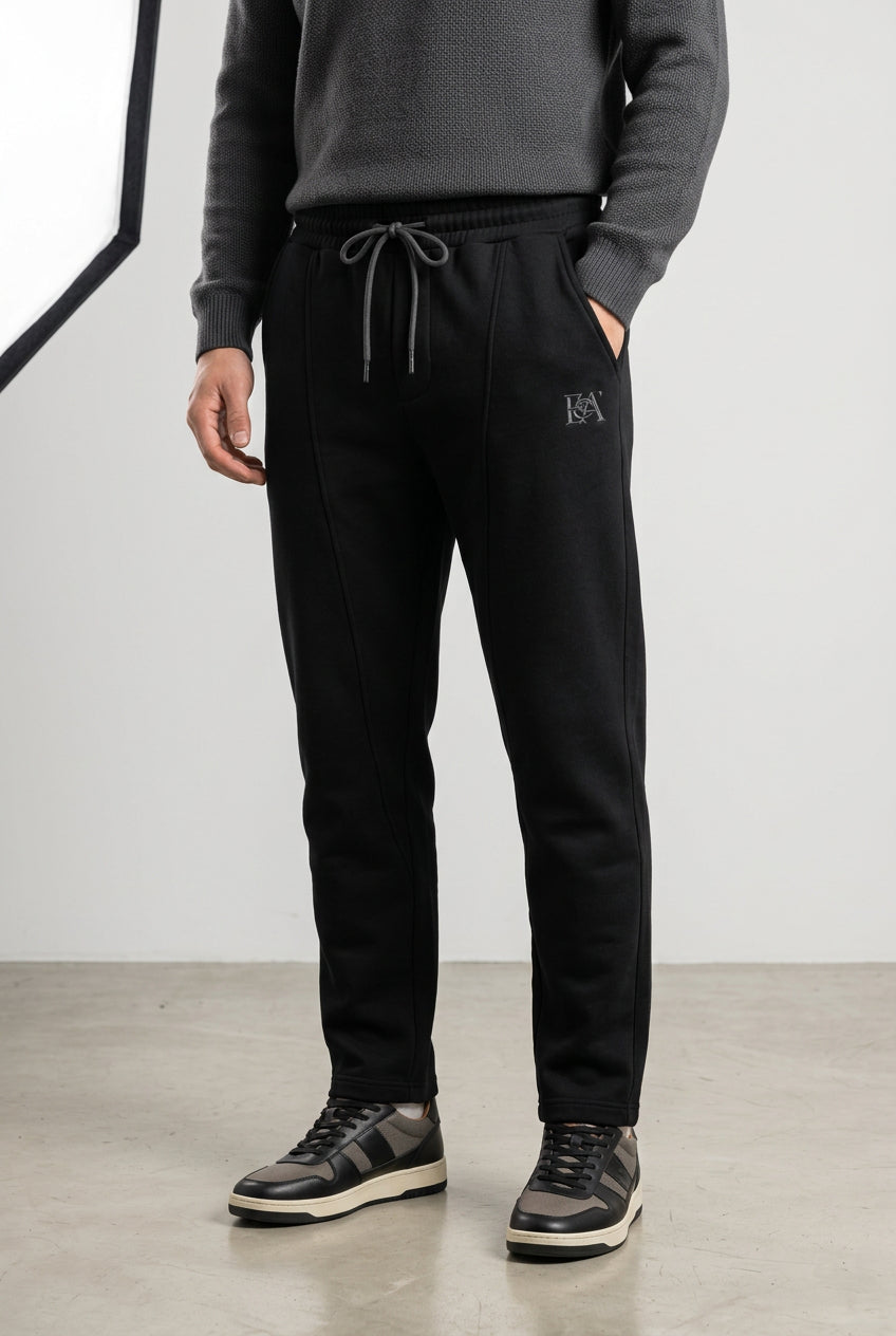 Black BA6 men's track pants with elastic waistband and side pockets, made from comfortable, sporty fabric.