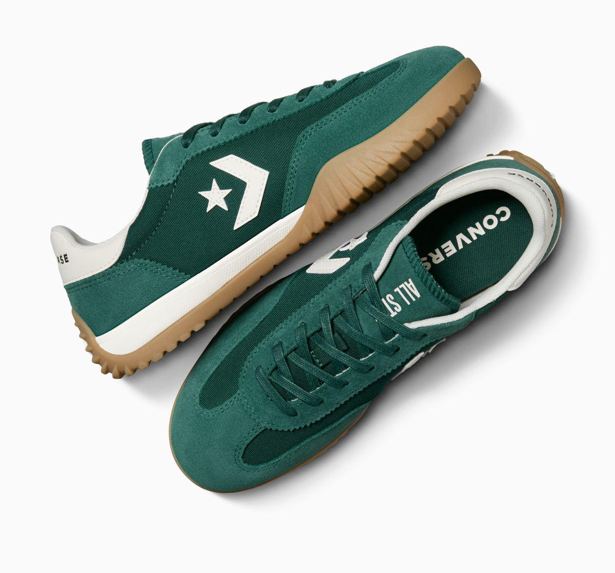 Green Converse Run Star Ox unisex sneakers with white sole and star logo, showcasing stylish casual footwear.