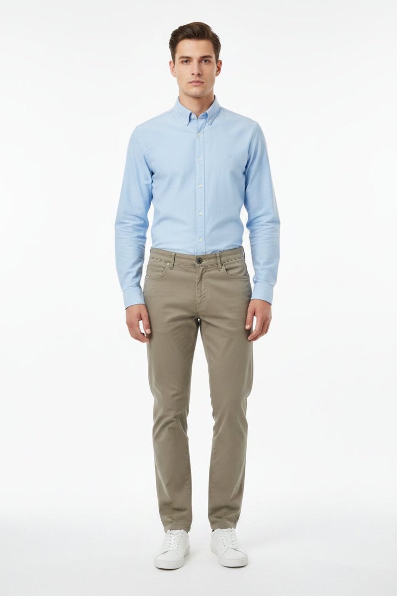 Men's Coxmoore Dark Khaki Chino pants displayed on a model, showcasing a classic fit and versatile style.